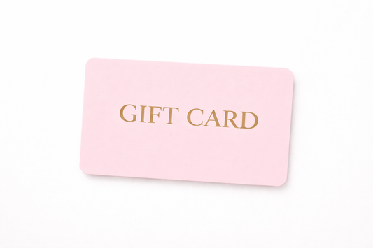 Pink gift card with gold text on a white background