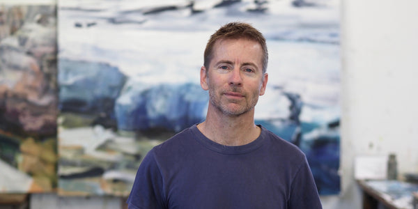 Tim Allen in front of one of his paintings